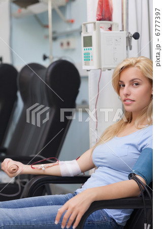 Female patient receiving a transfusion Female patient receiving a transfusion 6777397
