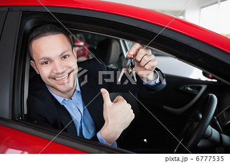 Happy man holding car keys Happy man holding car keys 6777535