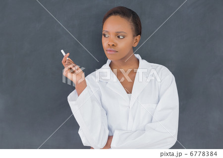 Front view of a teacher holding a chalk 6778384