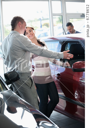 Woman talking with a salesman Woman talking with a salesman 6778652