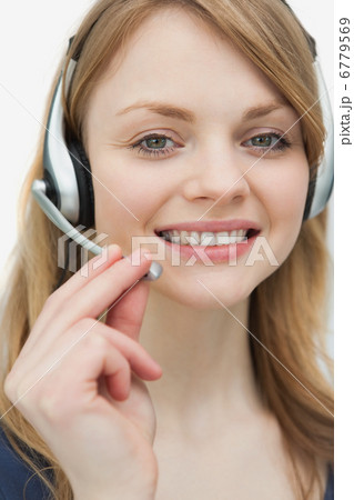 Woman with headset looking at camera 6779569