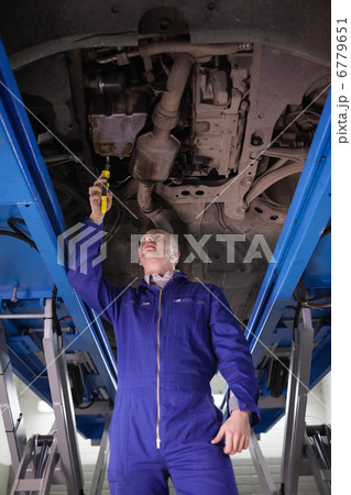 Mechanic repairing a car with an adjustable pliers 6779651