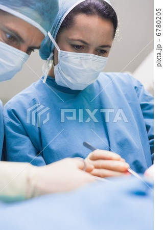 Doctor looking at a patient seriously 6780205