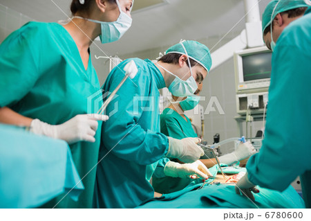Surgeon using surgical tool 6780600