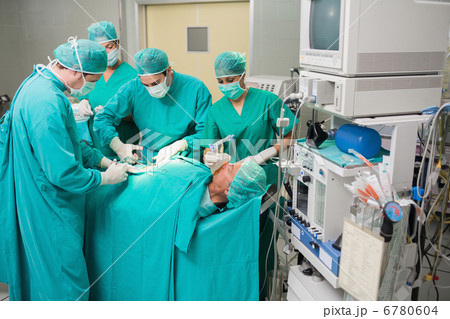 View of a medical team operating a patient View of a medical team operating a patient 6780604