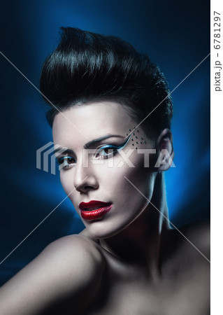 sexy brunette woman with red lips in dark blue light sexy brunette woman with red lips in dark blue light 6781297