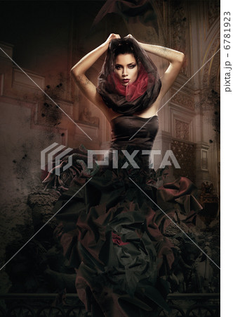 mysterious woman in dark hood in cathedral 6781923