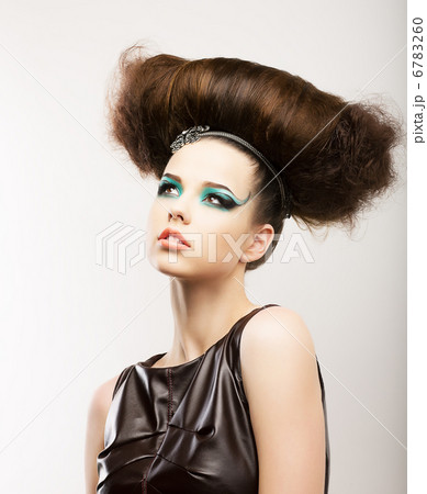 Fetish. Artistic Expressive Brunette with Frizzy Hairstyle. Creative Styling 6783260