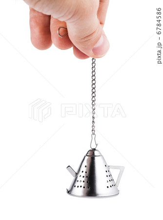 Hand holding Tea strainer, isolated on white 6784586