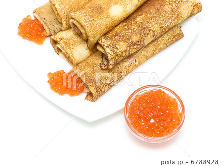 red salmon caviar and crepes on a plate on a white background red salmon caviar and crepes on a plate on a white background 6788928