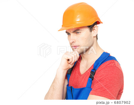 portrait of thinking handyman in uniform 6807902