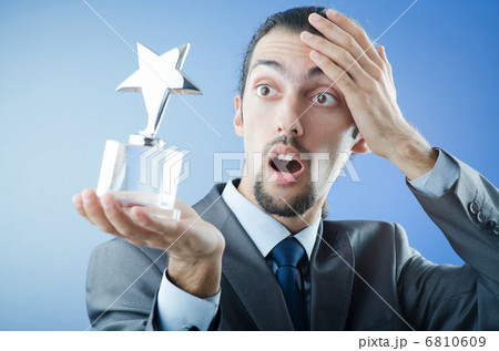 Businessman awarded with star award Businessman awarded with star award 6810609