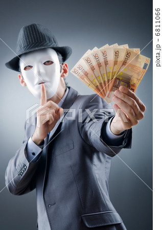 Businessman with money and mask 6811066