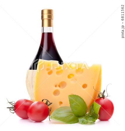 Red wine bottle, cheese and tomato still life Red wine bottle, cheese and tomato still life 6811562