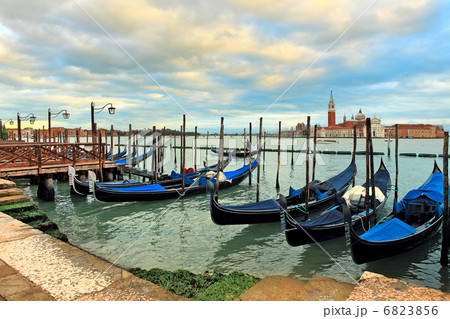 Gondolas moored in row on Grand canal in Venice. 6823856