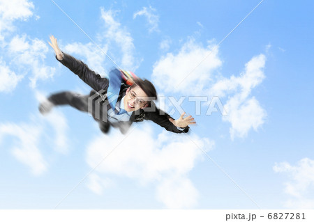 Young businessman flying with parachute on back 6827281