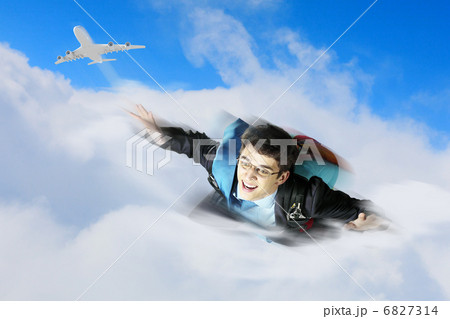 Young businessman flying with parachute on back Young businessman flying with parachute on back 6827314