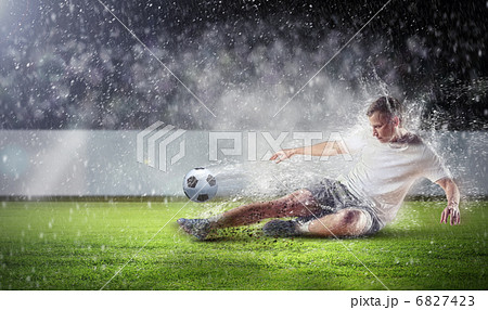 football player striking the ball football player striking the ball 6827423
