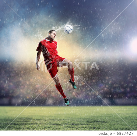 football player striking the ball football player striking the ball 6827427