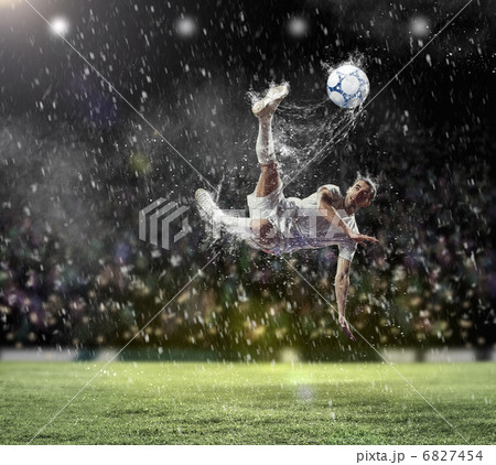 football player striking the ball 6827454