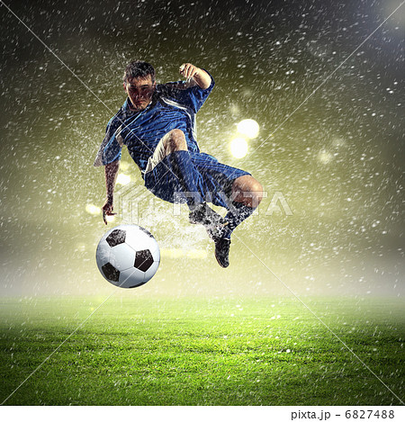 football player striking the ball football player striking the ball 6827488
