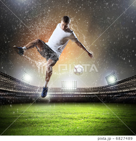 football player striking the ball 6827489