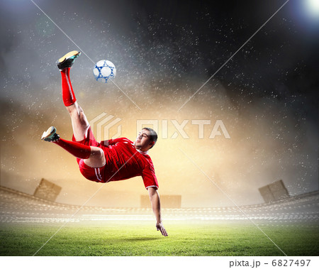 football player striking the ball 6827497