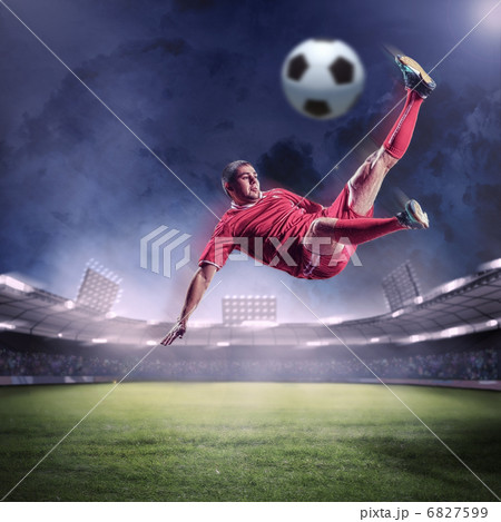 football player striking the ball football player striking the ball 6827599