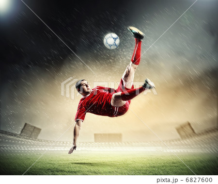 football player striking the ball football player striking the ball 6827600