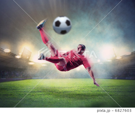 football player striking the ball football player striking the ball 6827603