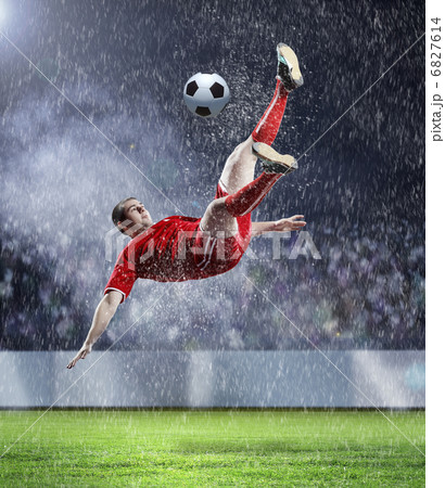 football player striking the ball football player striking the ball 6827614