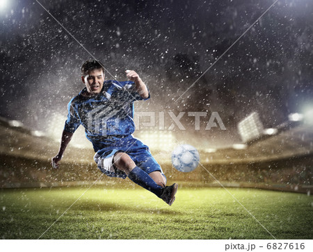 football player striking the ball football player striking the ball 6827616