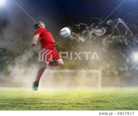 football player striking the ball 6827617