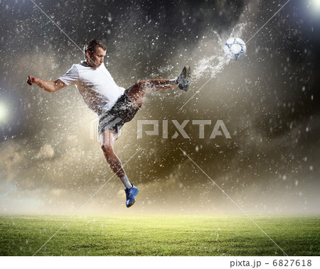 football player striking the ball 6827618