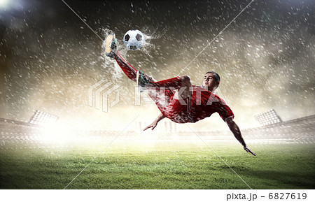 football player striking the ball football player striking the ball 6827619