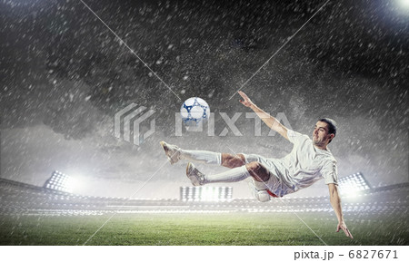 football player striking the ball football player striking the ball 6827671