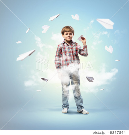 Little boy playing with paper plane Little boy playing with paper plane 6827844