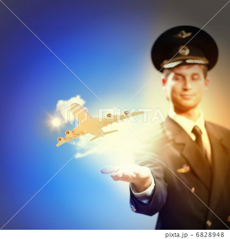 Image of pilot with plane in hand Image of pilot with plane in hand 6828948