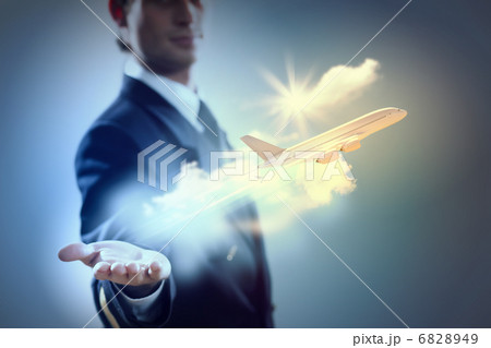 Image of pilot with plane in hand 6828949