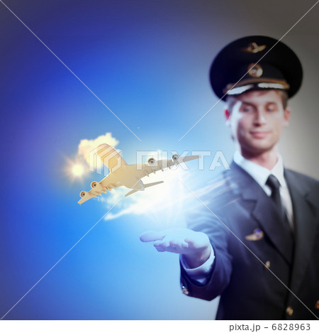 Image of pilot with plane in hand 6828963