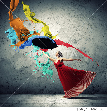Ballet dancer in flying satin dress with umbrella 6829328