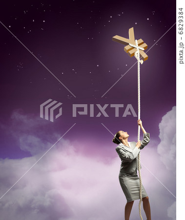 Image of businesswoman climbing the rope 6829384