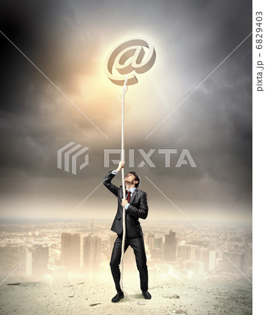 Image of businessman climbing rope Image of businessman climbing rope 6829403