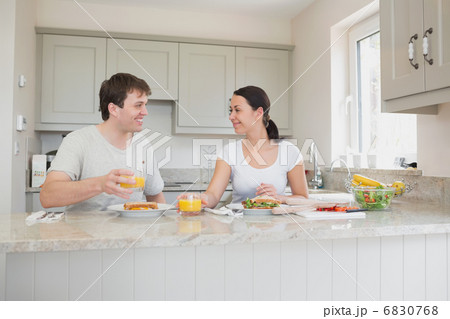 Young couple enjoying lunch 6830768