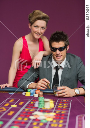 Couple smiling at the table 6830843