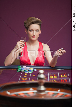 Woman playing roulette alone 6831328