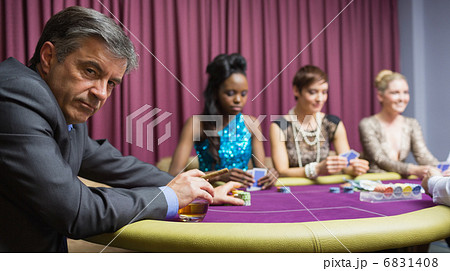 Man sitting at the table at the casino Man sitting at the table at the casino 6831408