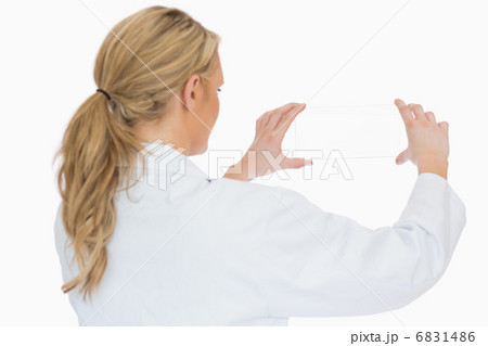 Doctor holding glass slide from behind 6831486