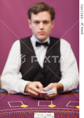 Dealer about to deal in poker game Dealer about to deal in poker game 6831491