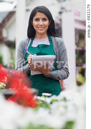 Woman checking plants Woman checking plants 6832179